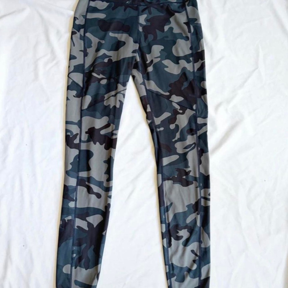 Simms Women's Med Bugstopper Legging in the "Woodland Camo Storm" pattern